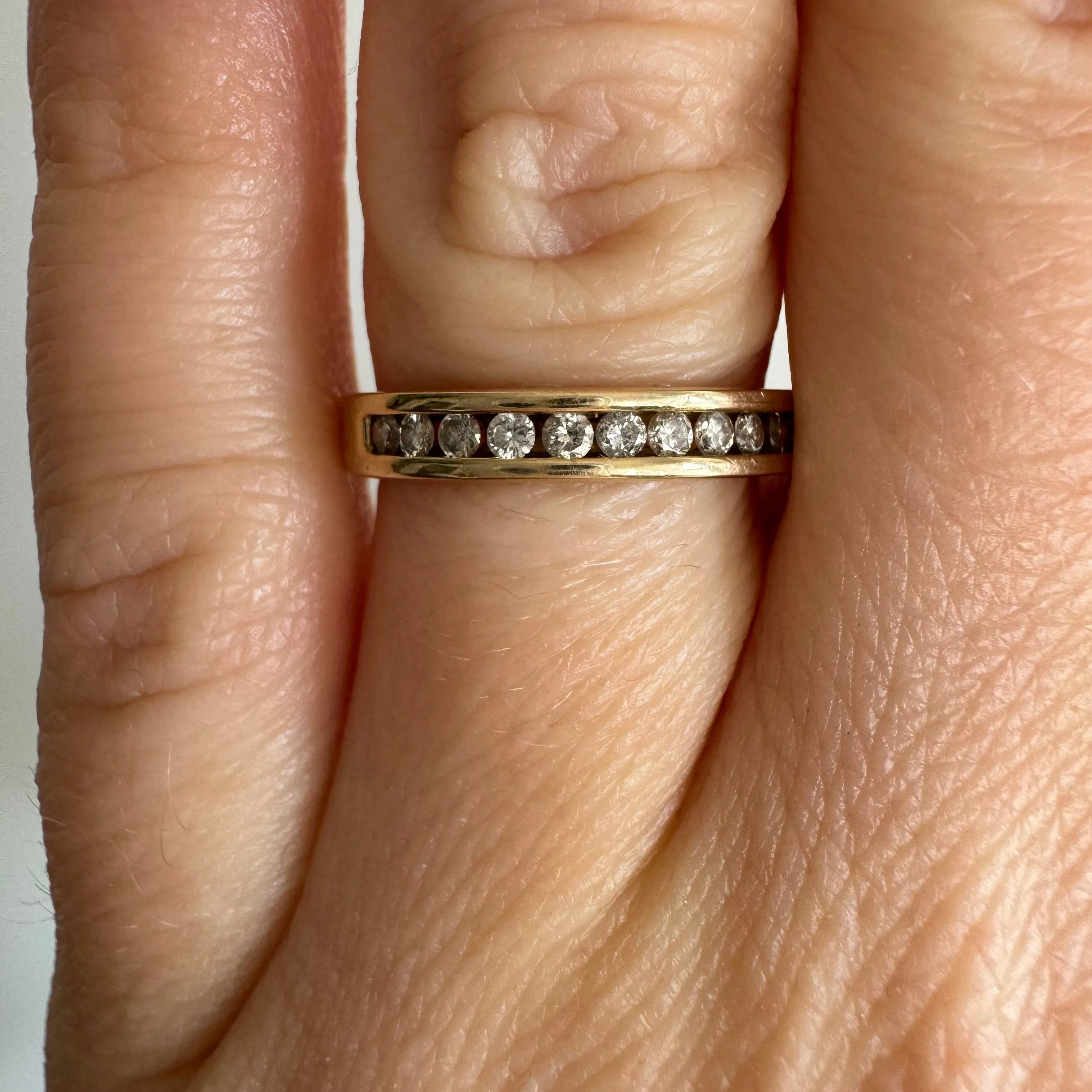 V I N T A G E // hidden LOVE / 10k yellow gold and channel set diamond half eternity band / size 5