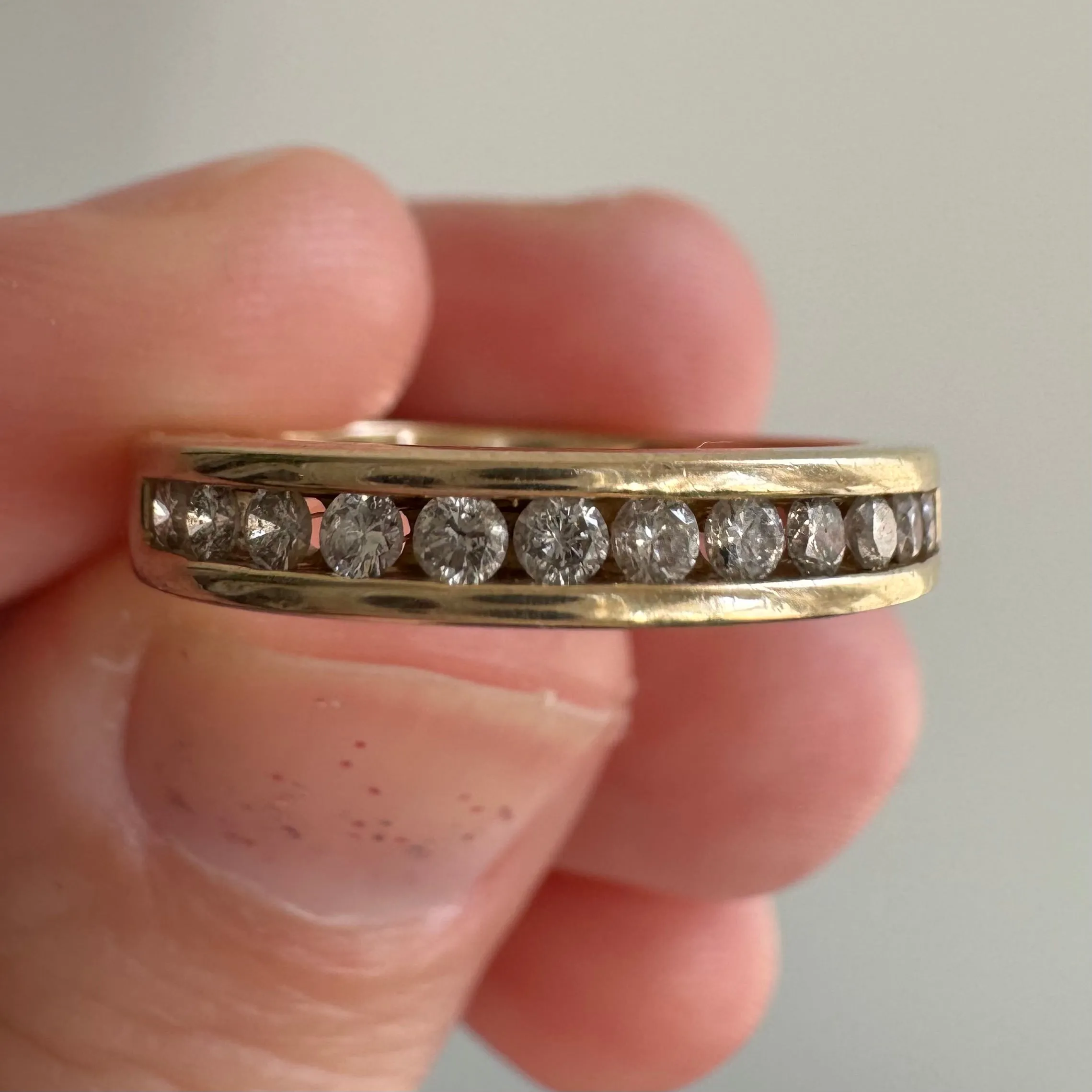 V I N T A G E // hidden LOVE / 10k yellow gold and channel set diamond half eternity band / size 5