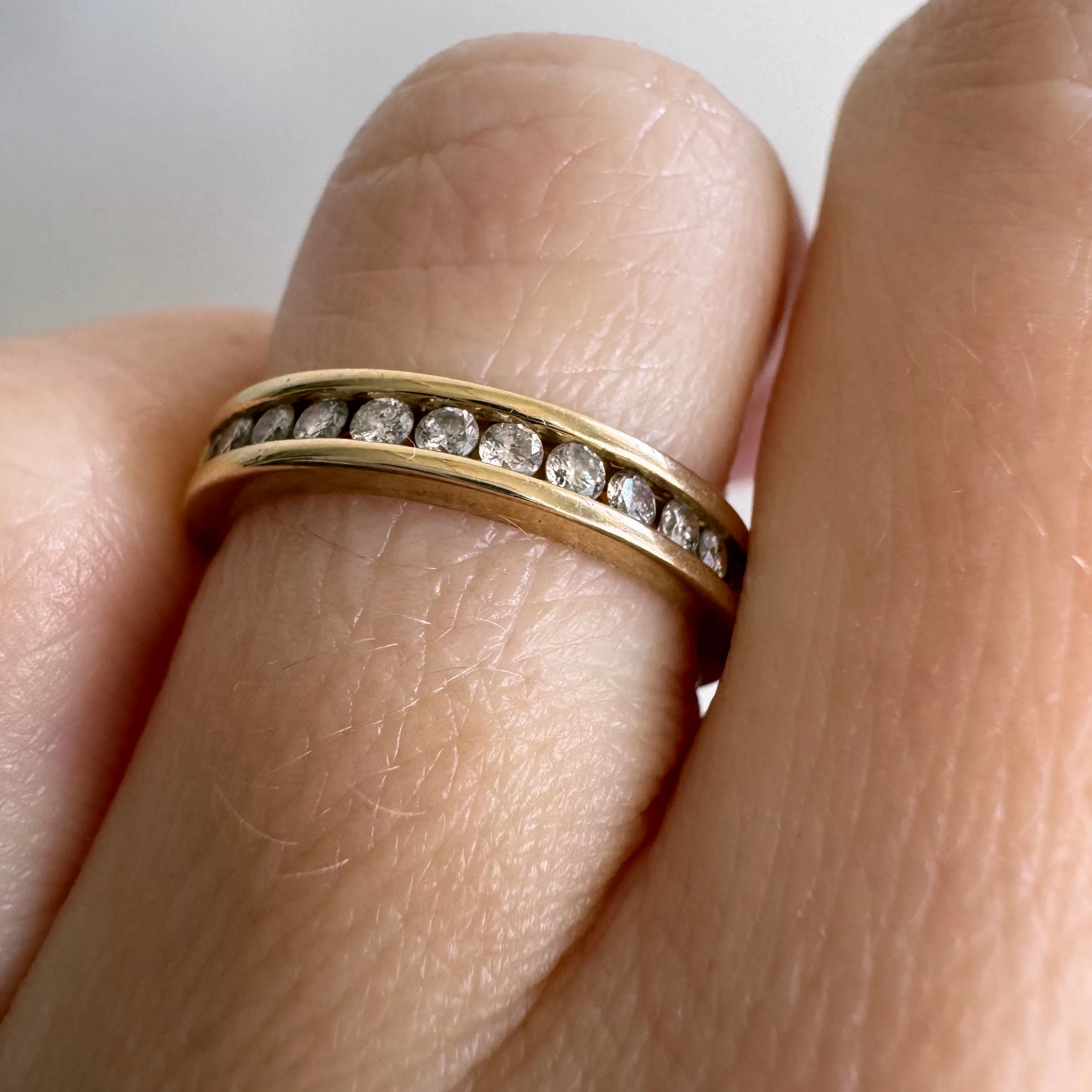 V I N T A G E // hidden LOVE / 10k yellow gold and channel set diamond half eternity band / size 5